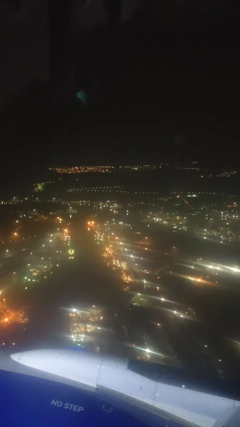 View of City from a flight window on a night Stock Footage 142489249