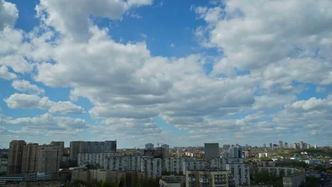 View of the city from high. Floating clouds on the blue sky. Stock Footage 74735297