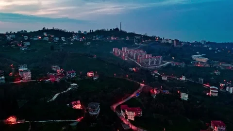 View of a city at night with a hill in the background Stock-Footage 267676691