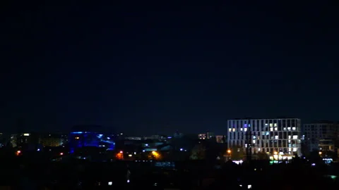 View of the city at night with lights shining in the windows Stock Footage 292491365