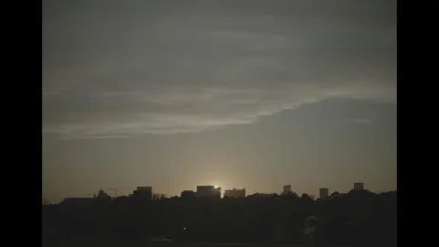 View of city from park at sundown Video stock 285474447