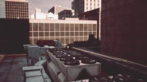 A view of a city from a rooftop of a building Ilustración de archivo