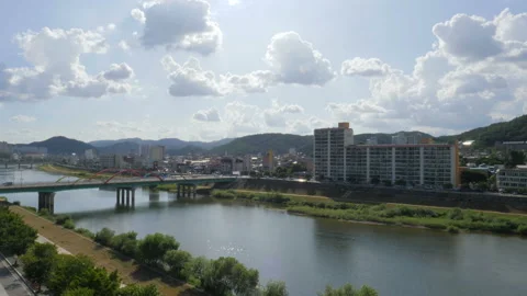 The view of the city from the rooftop, the river flowing between the bridges, th Stock Footage 94011689
