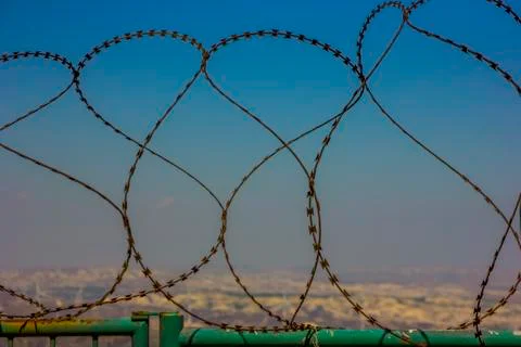 View of the city through barbed wire Stock Photos