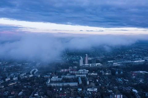 View of the city through the clouds Фото