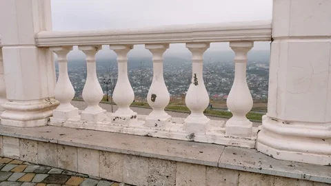 View of the city through columns of balustrade. Autumn sky. Stock Footage 101653907