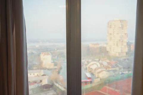 A view of the city through a double-hung window 스톡 사진