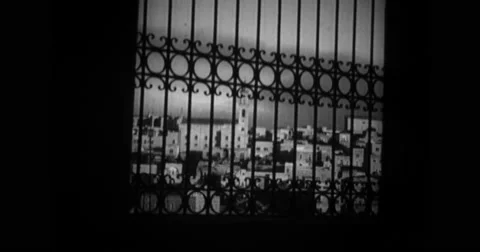 View of city through window grill Stock Footage