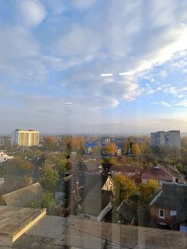 A view of a city from a window of a building Stock Photos