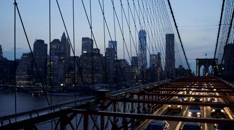 View of cityscape and car moving on Brooklyn bridge at dusk, New York City, USA Stock Footage 61132573