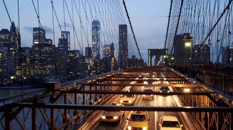 View of cityscape and car moving on Brooklyn bridge at dusk, New York City, USA Stock Footage 61132582