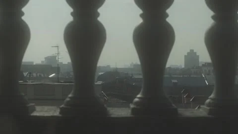 View of the cityscape through the balusters Stock Footage 95808961