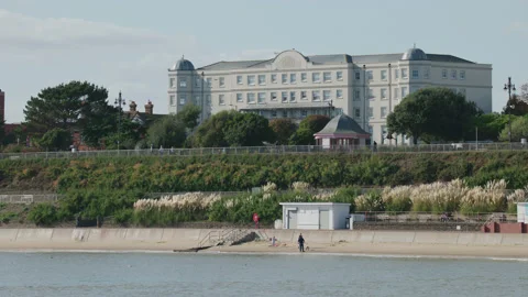 A view from Clacton-on-Sea pier to the sandy beach and promenade. 4K tripod Stock Footage 219790522