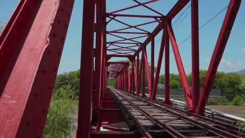 View of a Classic Red Railway Bridge Stock Footage 293387466
