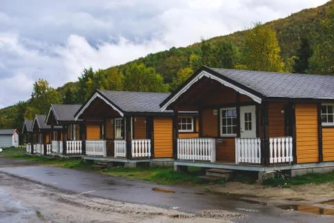 View of Classical Norwegian Camping site with traditional wooden red cottages Stock Photos