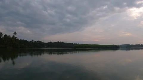 View of a clean river and its surroundings while travelling in a boat, India Stockbeeldmateriaal 122914058