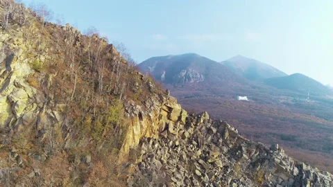 View of the cliff and mountain in the distance Stock Footage 152956584