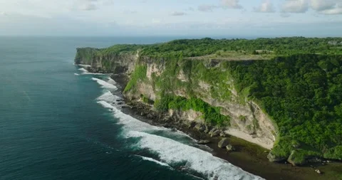 View from cliff of ocean, sky meets liquid horizon in natural landscape Stock Footage 270793236