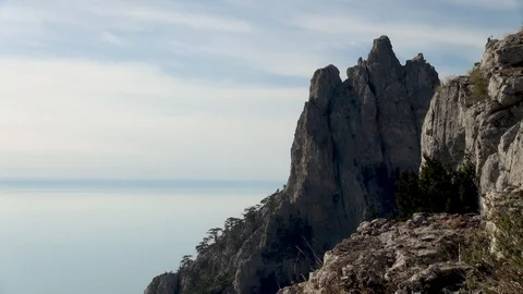 View of cliff resembling trident from horizontal plateau of Mount Ai Petri. Stock Footage 106774845