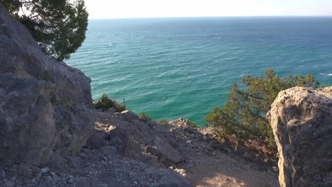 View from a cliff to the turquoise sea Stock Footage 130811336
