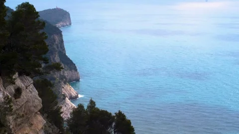 View on cliffs and lighthouse from hiking trail in Portovenere Stock Footage 254544947