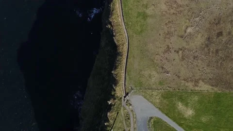 View of the Cliffs of Moher from above. Line of rocks and ocean. Stock Footage 175460659