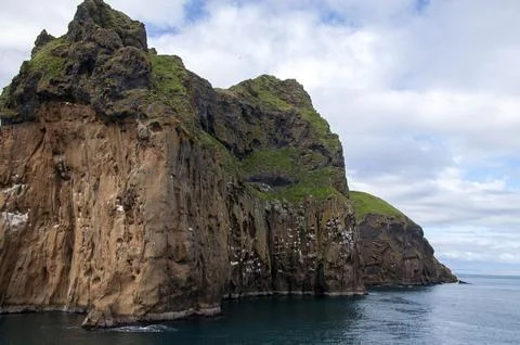 View of cliffs from ocean Stock Photos