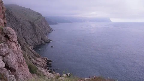 View of the cliffs of the sea and mountains in the fog. Stock Footage 76251517