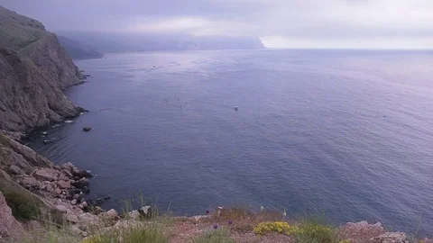 View of the cliffs of the sea and mountains in the fog. Stock Footage 76251987