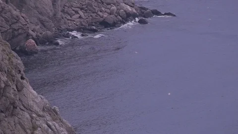 View of the cliffs of the sea and mountains in the fog. Stock Footage 76254487