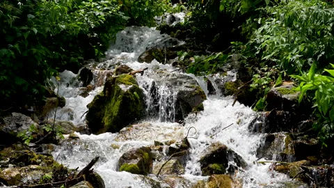A view of climbing a mountain with a river full of water. Stock Footage 159041078