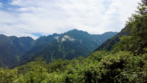 A view of climbing a mountain with a river full of water. 動画素材 159042159
