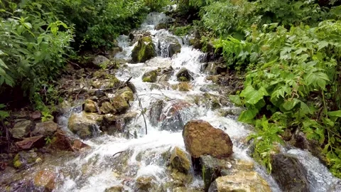 A view of climbing a mountain with a river full of water. Stock-Footage 159042650