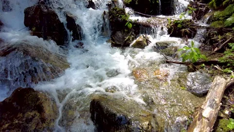 A view of climbing a mountain with a river full of water. 스톡 동영상 159043119