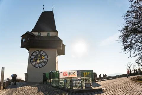 View at clock tower in Graz on a blue sky in winter Stock Photos