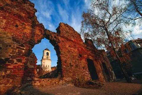 View of the Clock Tower from the ruins of the Old cathedral in the town of Stock Photos