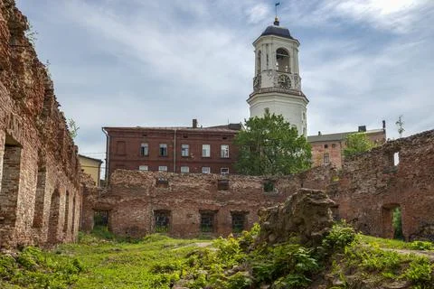View of the clock tower from the territory of the destroyed cathedral. Vyborg Stock Photos