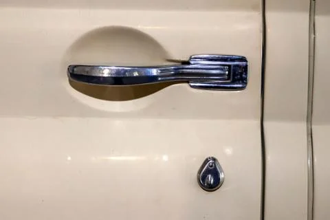 View on closed front door with handle and keyhole of the old Russian yellow r Stock Photos