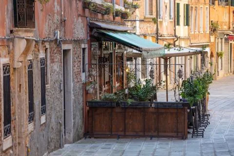 View to a closed restaurant on a small square in Venice, Italy Stock Photos