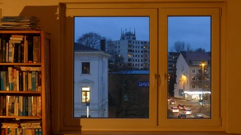 View from closed window in a living room from the inside onto street and hous Stock Footage 122912914