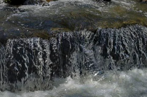 View closeup of waterfall part at cascade of river Bistritsa Stock Photos
