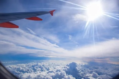 View of cloud and sky from airplane window Stock Photos