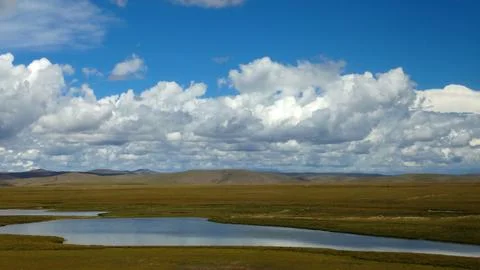 View of cloud on the plain in suuny day Stock Photos