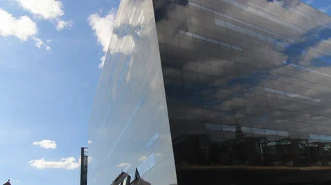 View of cloud reflections in windows of Royal Library in Copenhagen, Denmark Stock Footage 40464736
