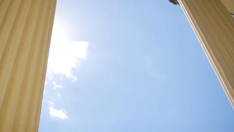 View on cloudless blue sky and brightly shining sun through baroque monumental Stock Footage 99604049