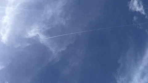 View of a cloudless blue sky with light feathery clouds Stock Photos