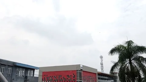 View of the clouds above the building in the afternoon Stock Footage 136940434