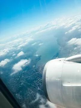 A view of the clouds from above in flight by an airplane from a luminator wit Stock Photos