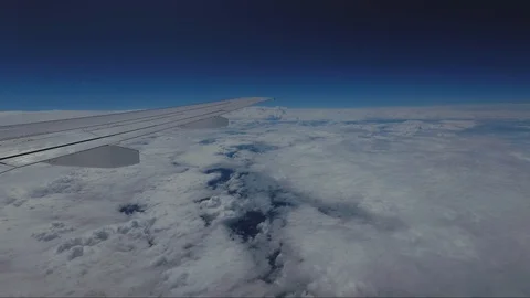 View of the Clouds from the Airplane Window at an Altitude of 12,000 meters Stock Footage 92139086