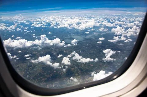View of clouds from an airplane window. Stock Photos